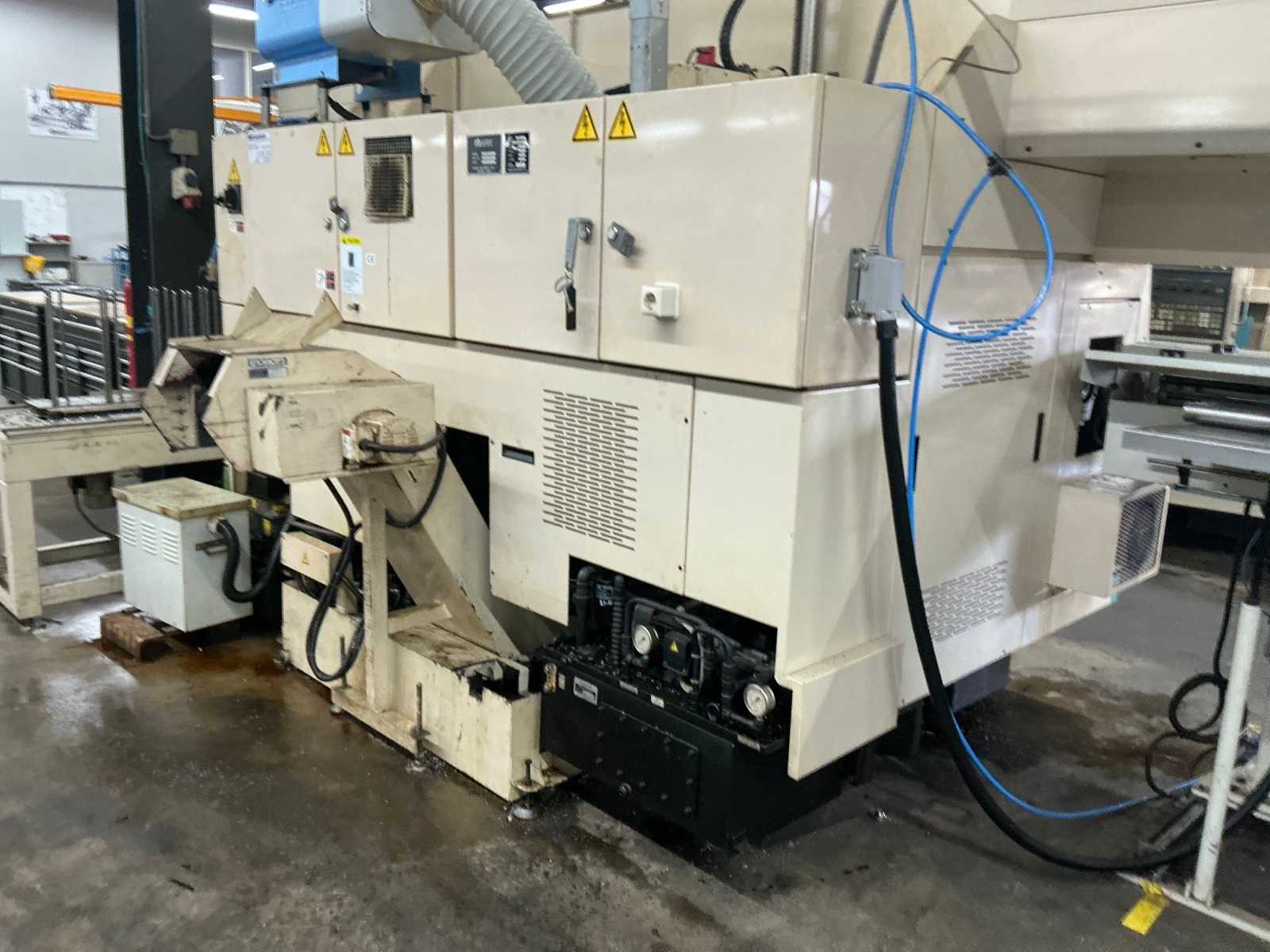 2001 Muratec MT12 Dubbelkops CNC draaibank met Samsys multi 5-65 aanvoer