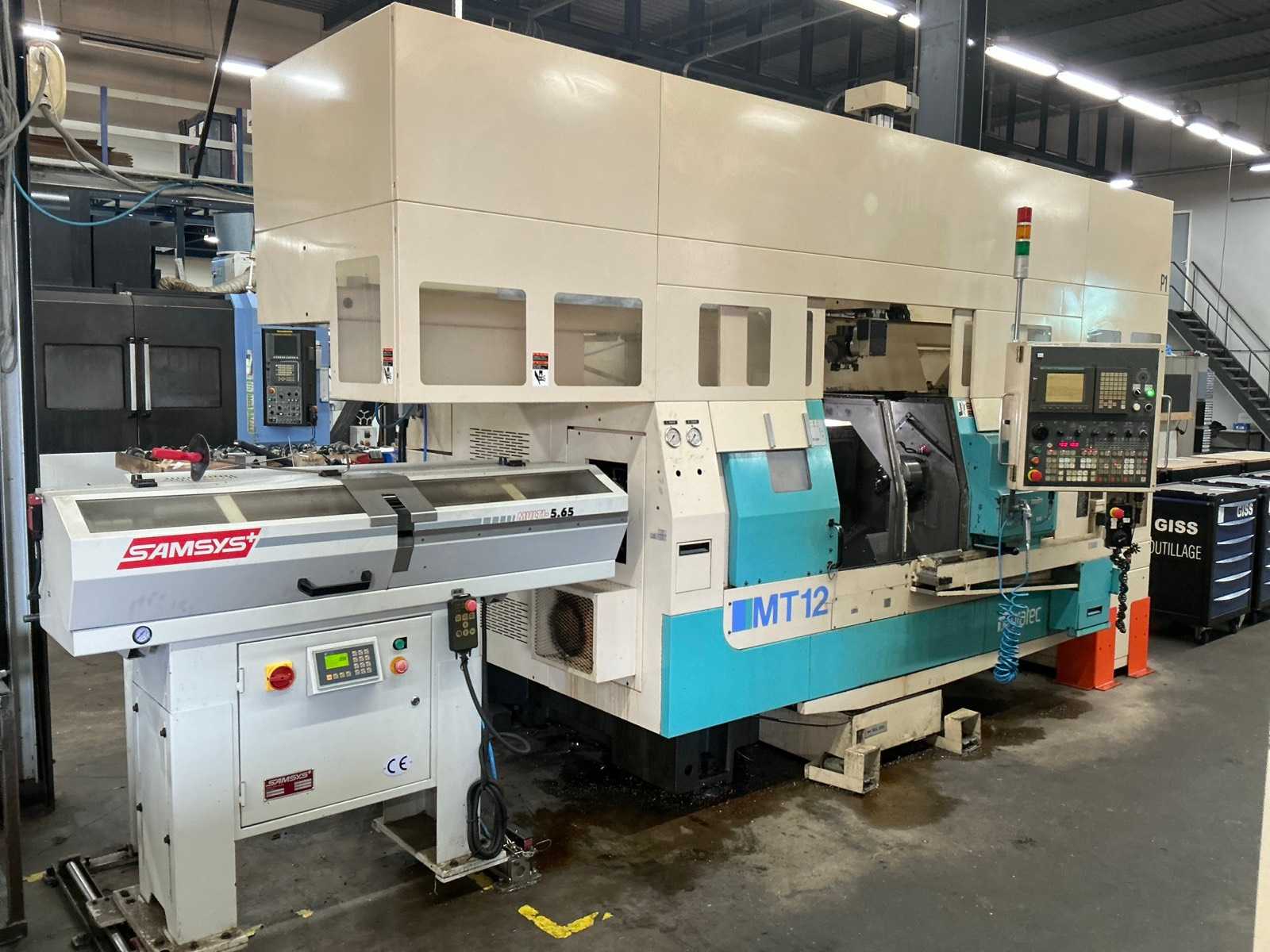 2001 Muratec MT12 Dubbelkops CNC draaibank met Samsys multi 5-65 aanvoer