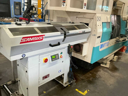 2001 Muratec MT12 Dubbelkops CNC draaibank met Samsys multi 5-65 aanvoer