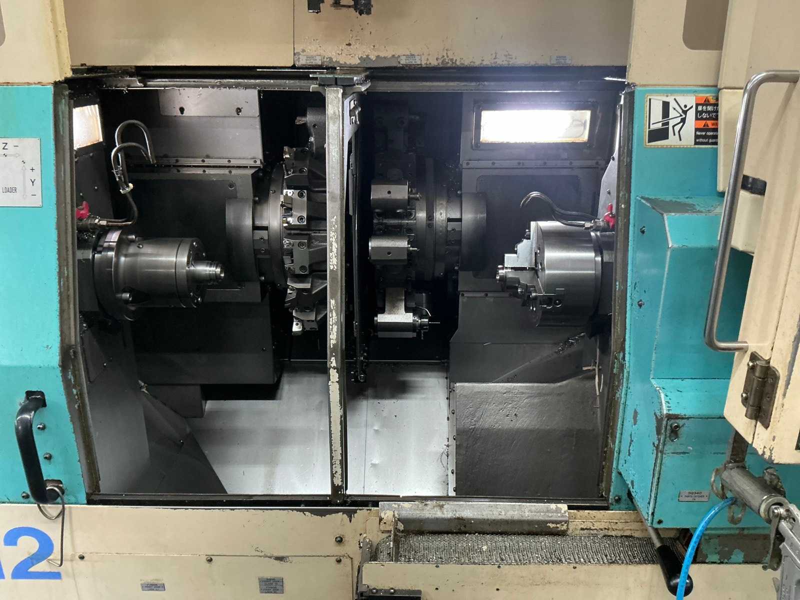 2001 Muratec MT12 Dubbelkops CNC draaibank met Samsys multi 5-65 aanvoer