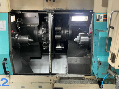 2001 Muratec MT12 Dubbelkops CNC draaibank met Samsys multi 5-65 aanvoer