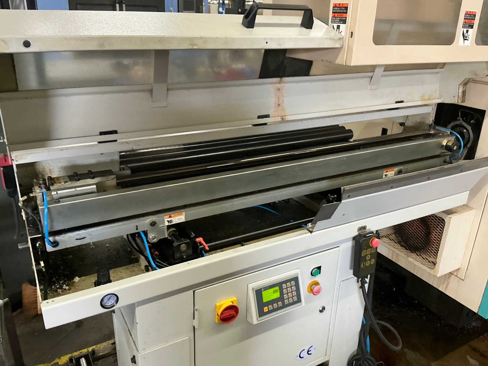 2001 Muratec MT12 Dubbelkops CNC draaibank met Samsys multi 5-65 aanvoer