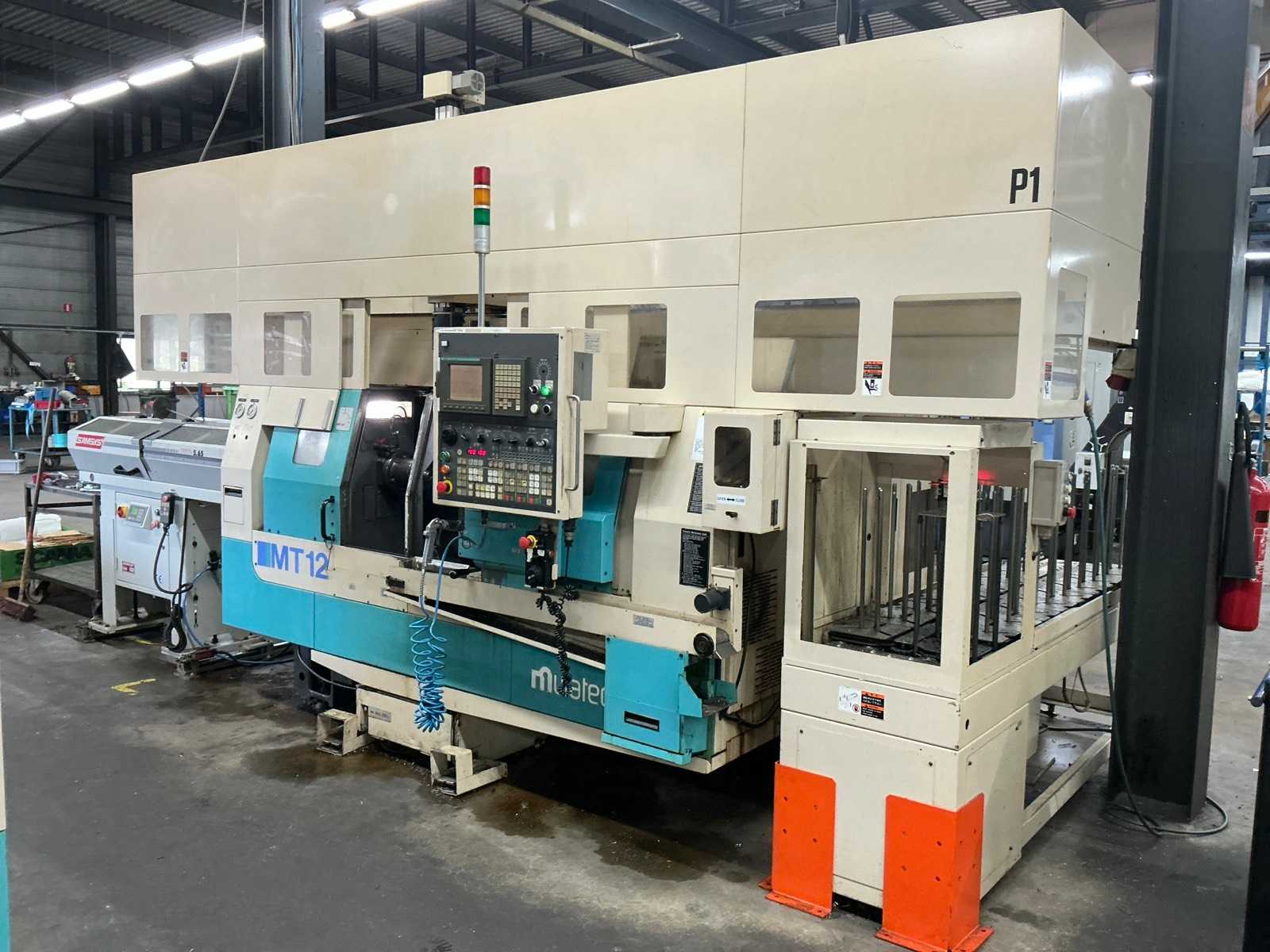 2001 Muratec MT12 Dubbelkops CNC draaibank met Samsys multi 5-65 aanvoer